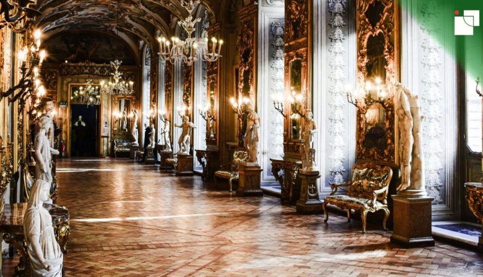 A grand historical hall filled with ornate mirrors, chandeliers, and classical statues, symbolizing the cultural heritage and traditions shaped by centuries of etiquette.
