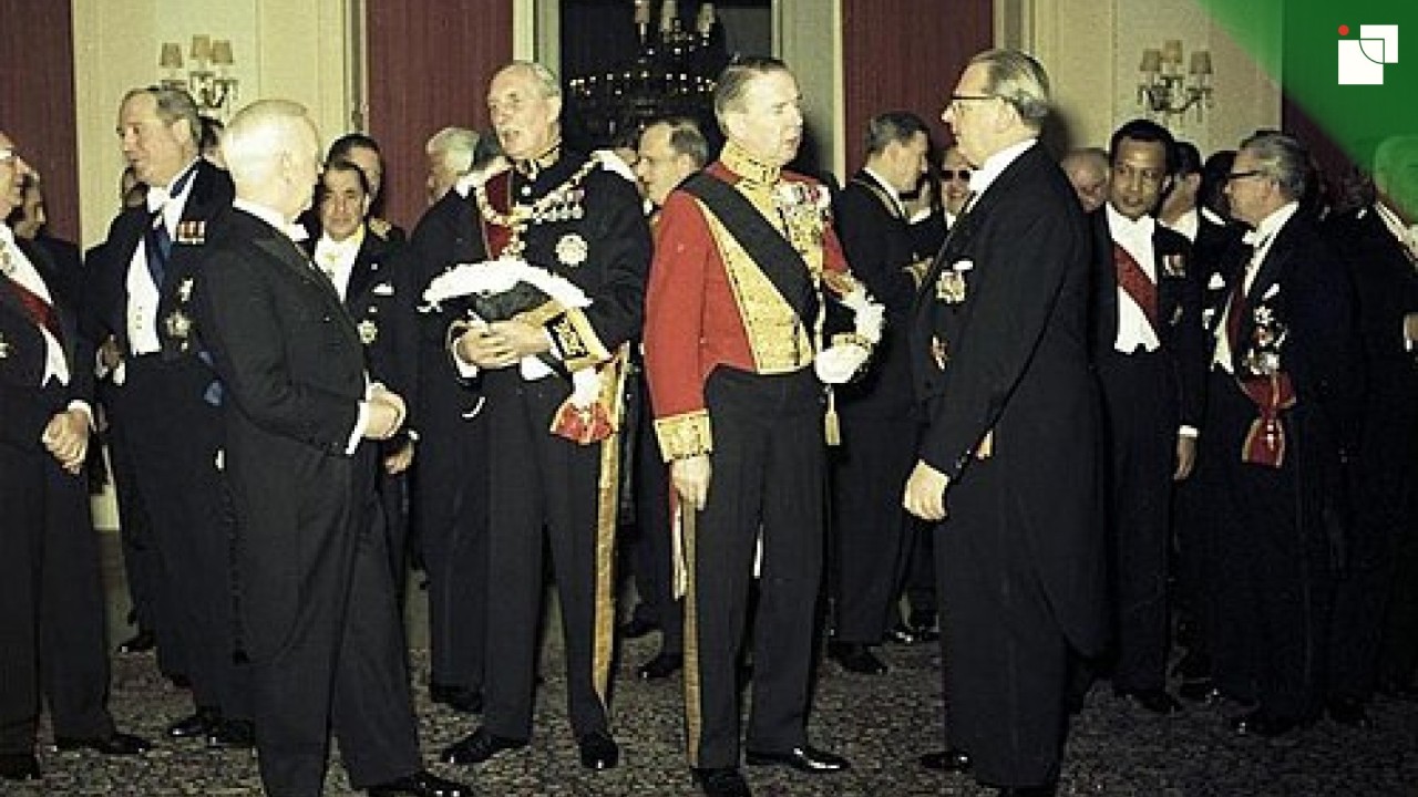 Formal white tie evening dress worn at a diplomatic state occasion