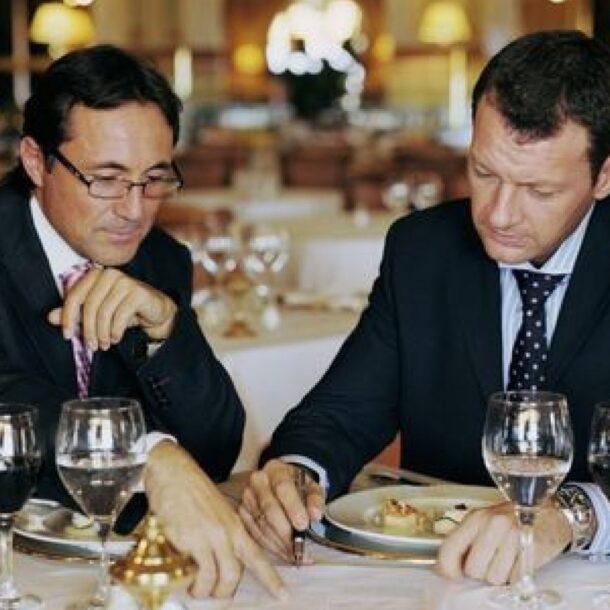 Colleagues in conversation during a business lunch