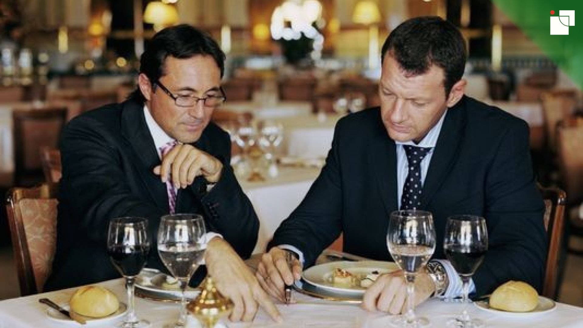 Colleagues in conversation during a business lunch